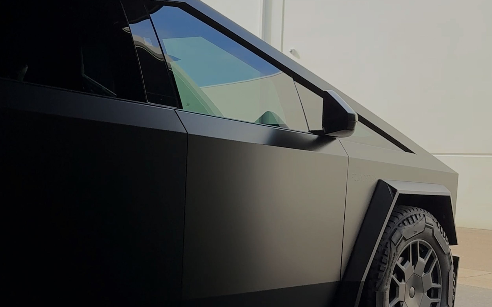 Black PPF — gloss black film on a Tesla Cybertruck
